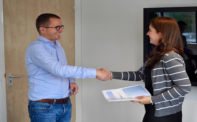 man and woman shaking hands
